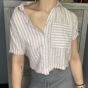 A dress up or dress down button up crop top.